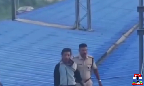 ரயில் நிலையத்தின் மேற்கூரையில் ஏறி தற்கொலை மிரட்டல்